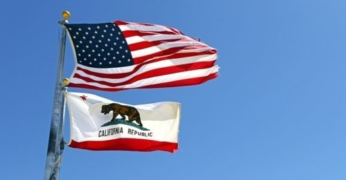 California state flag and American flag with blue sky background ...